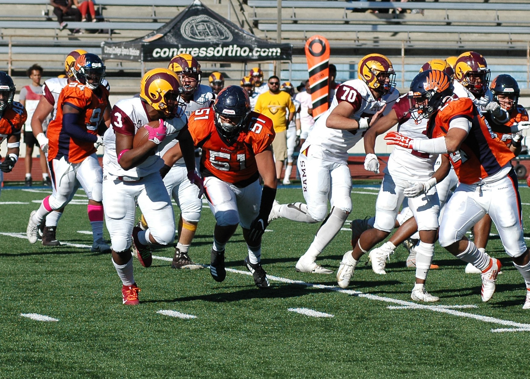 Jorge Salinas(51) and Abood Elias(24) hone in on the Victor Valley quarterback. Image: Thomas Garcia