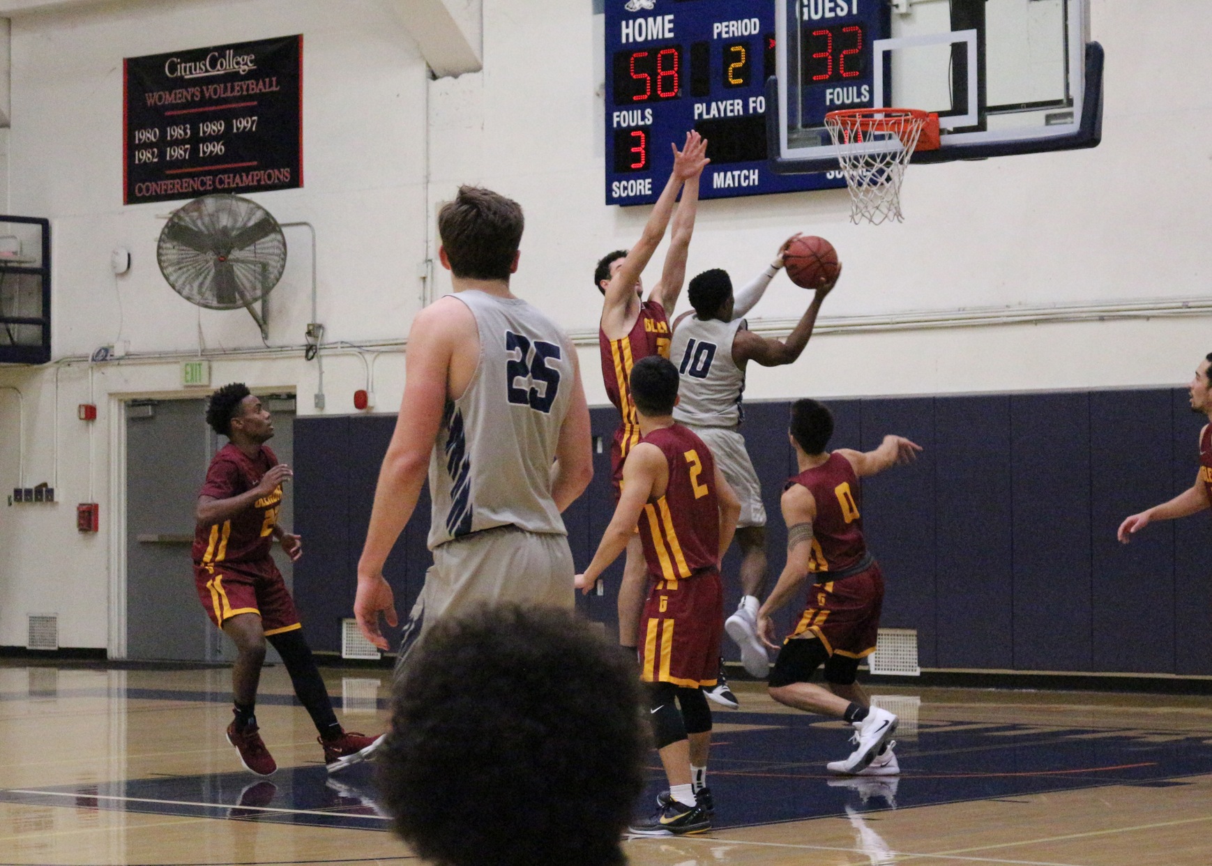 Toby Okwuokei drives the lane and lays up for 2.