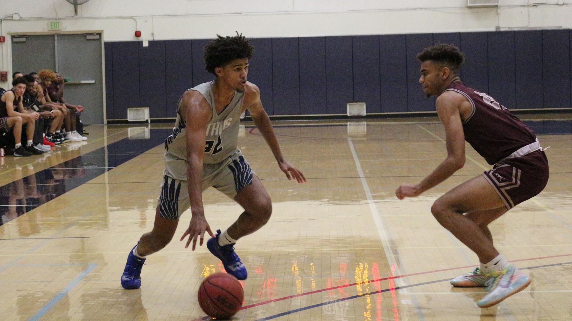 Kendal Frey drives past his defender to the basket. Photo by: Briana Jara