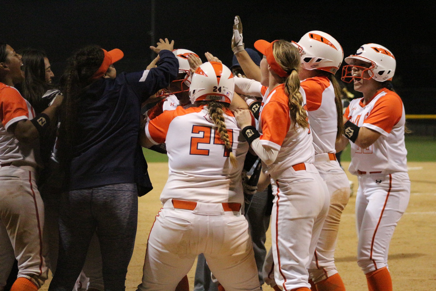 The Owls celebrate at the plate. Photo credit: Professional Photographer Extraordinaire, Alyssa Roman