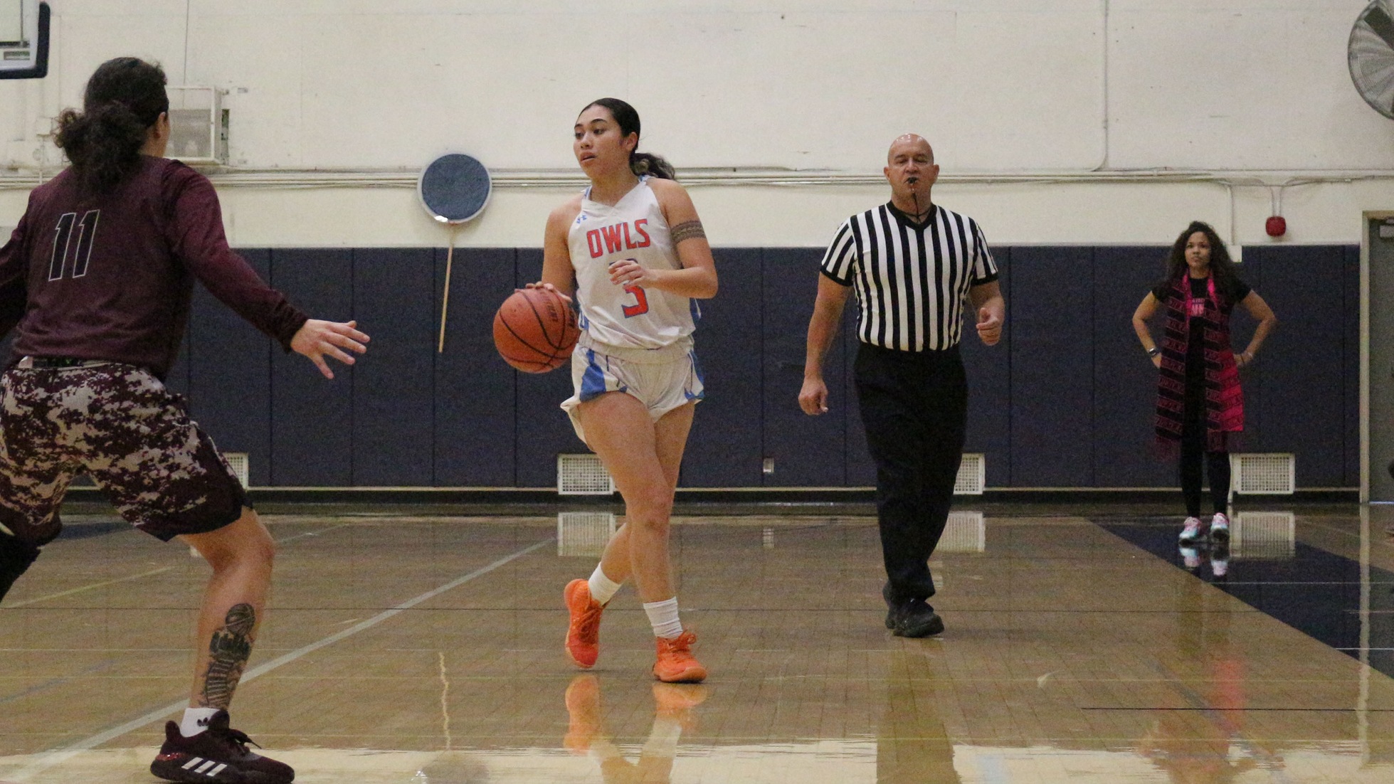Malia (Rocha) Ili dribbles it down the court. Photo by: Briana Jara