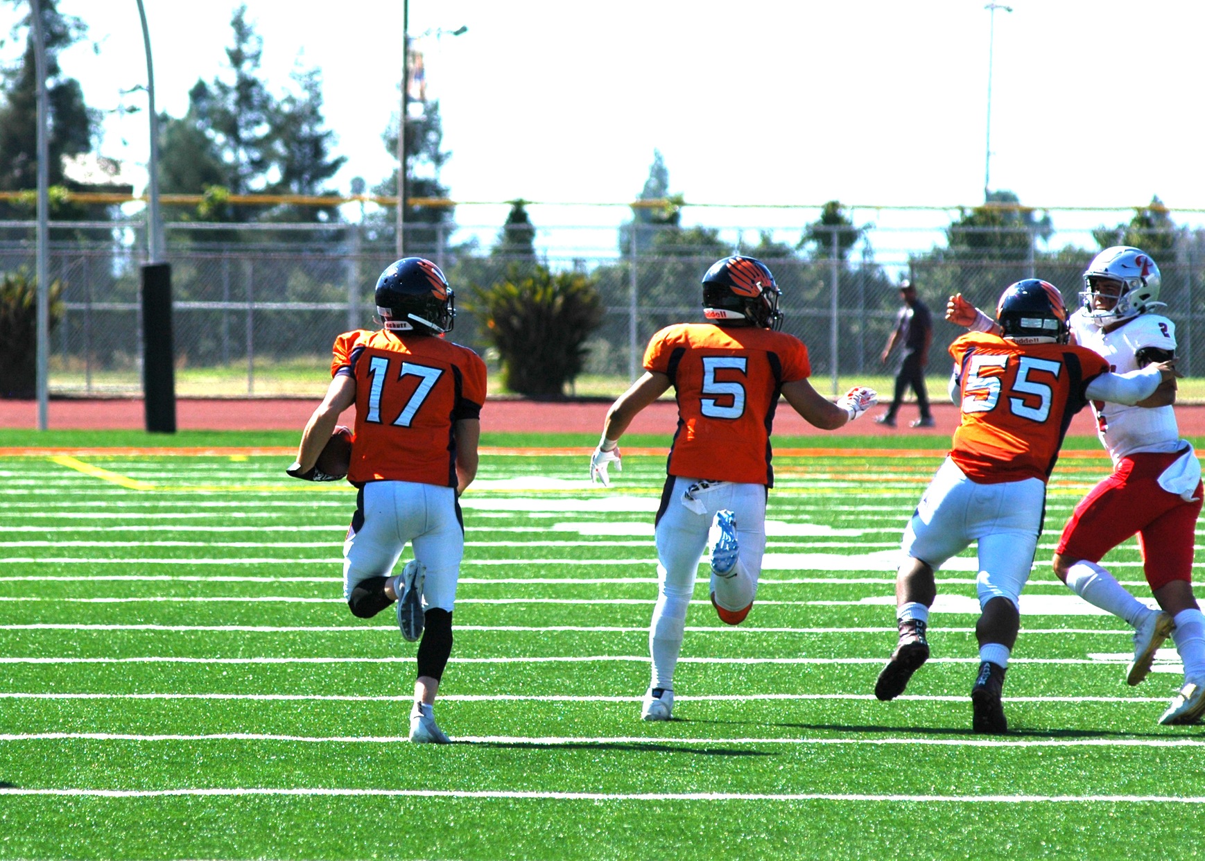 Michael Coombes (17) looks ahead as Joseph Castillo (5) and Seve Watson (55) clear the path. Image: Thomas Garcia