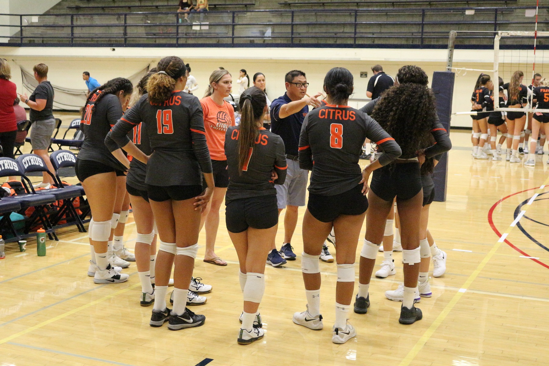 Head Coach Shin Jung addresses his team in the huddle. Image: Richard Miranda, II.