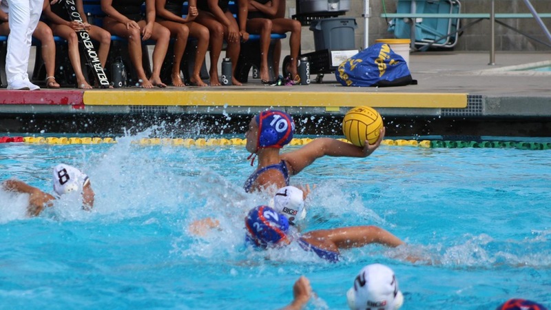 Attacker Hannah Long loads the cannon.